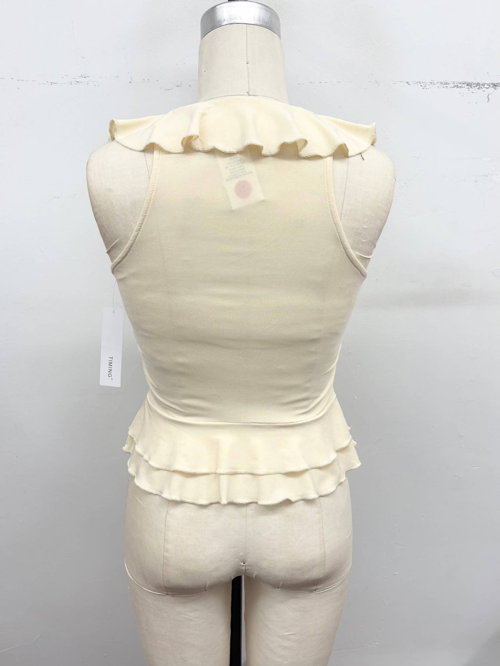 Ruffle Trim Sleeveless Peplum Top