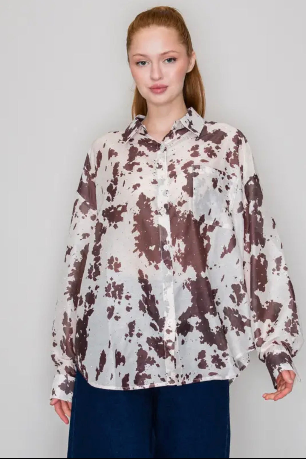 Dusty Trails Cow Print Button-Up Top